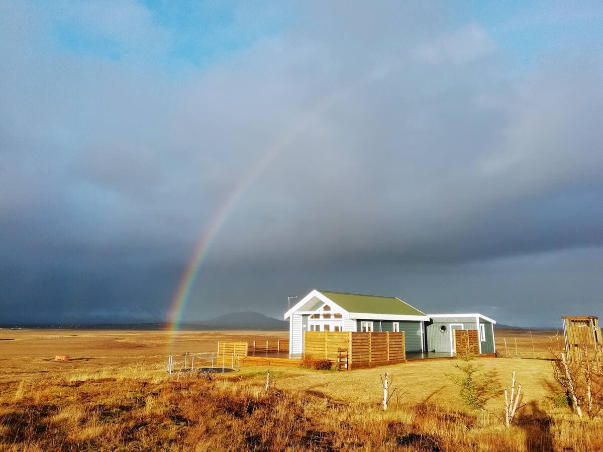 Cabin exterior with rainbow